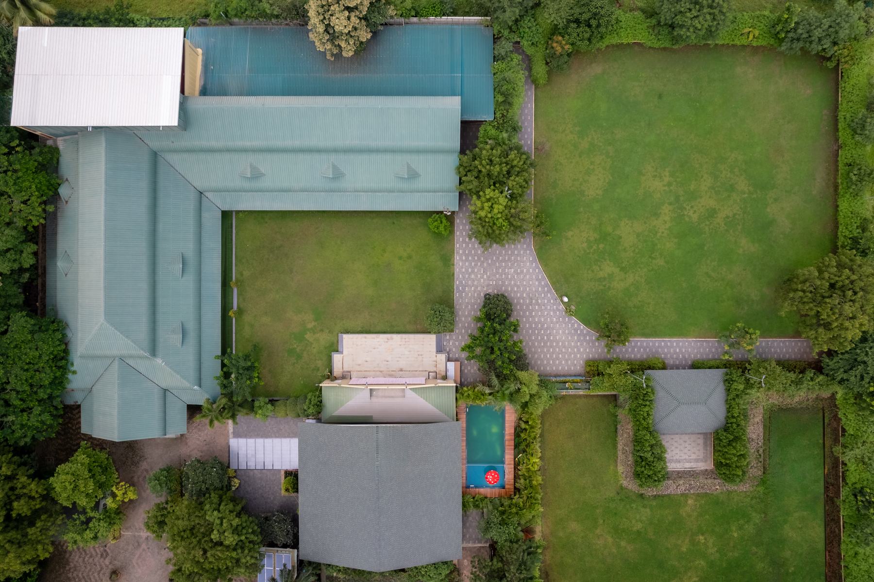 Aerial view of Orayana: two lawns, the covered hall, the villa and the gardens